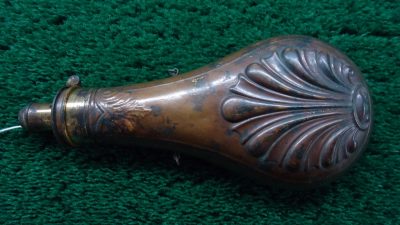 F1047  UNMARKED SHELL AND BUSH FLASK [A]