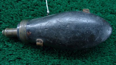 F1077  UNMARKED LEATHER COVERED POWDER FLASK
